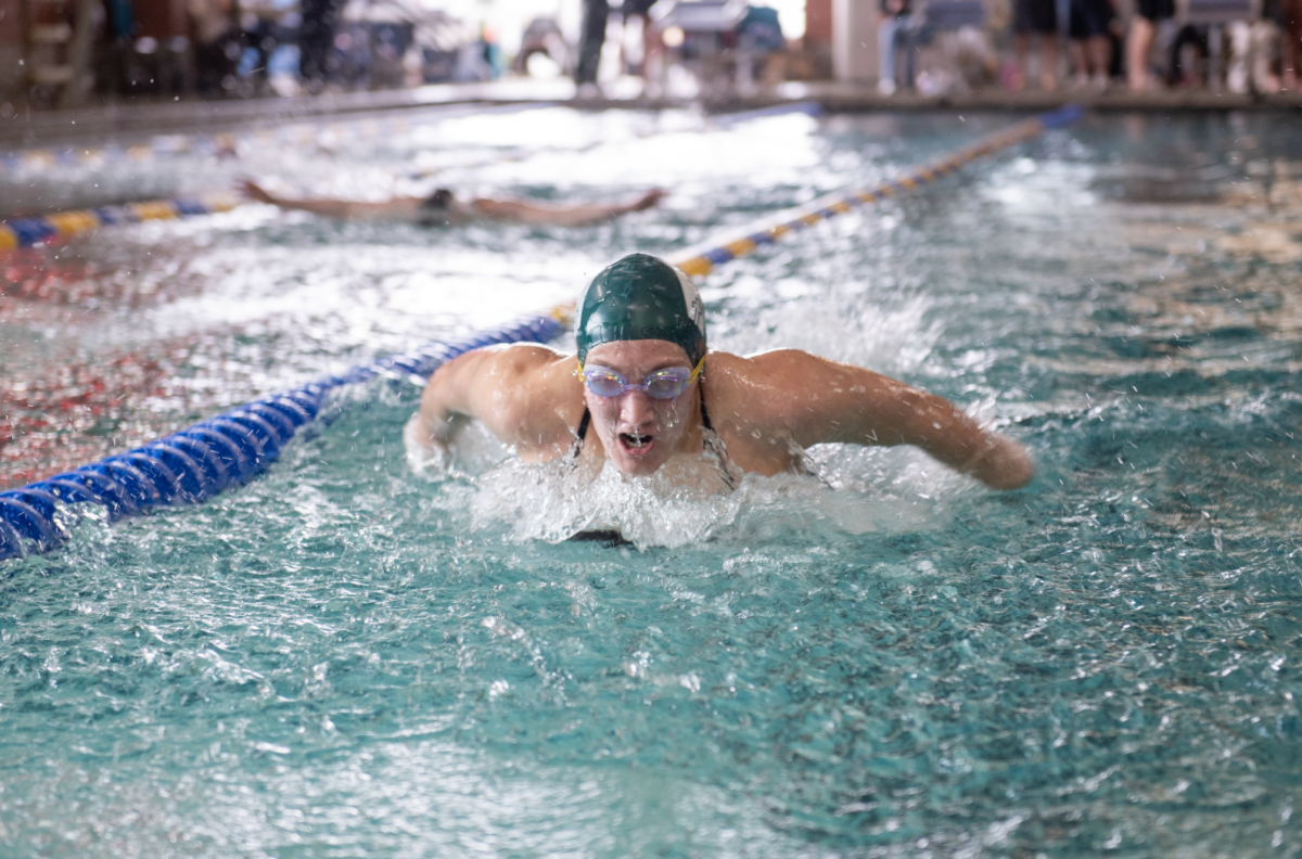 1.31.25 Senior Allison Elings swimming 100 butterfly at Butte. 